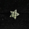 Green checkered star piercing