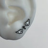 Black and white cross wing piercing set