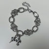 Double cross piercing bracelet