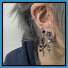 Black chrome rose drop earrings