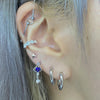 Blue heart drop piercing