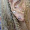Multiple pink heart piercing