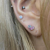 Multiple pink heart piercing